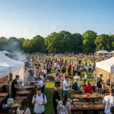 A vibrant scene from the Feast On Festival in Bristol, featuring food stalls and live music.