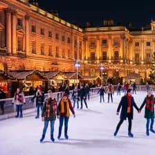 Ice rink with a giant Christmas tree in the Somerset House courtyard